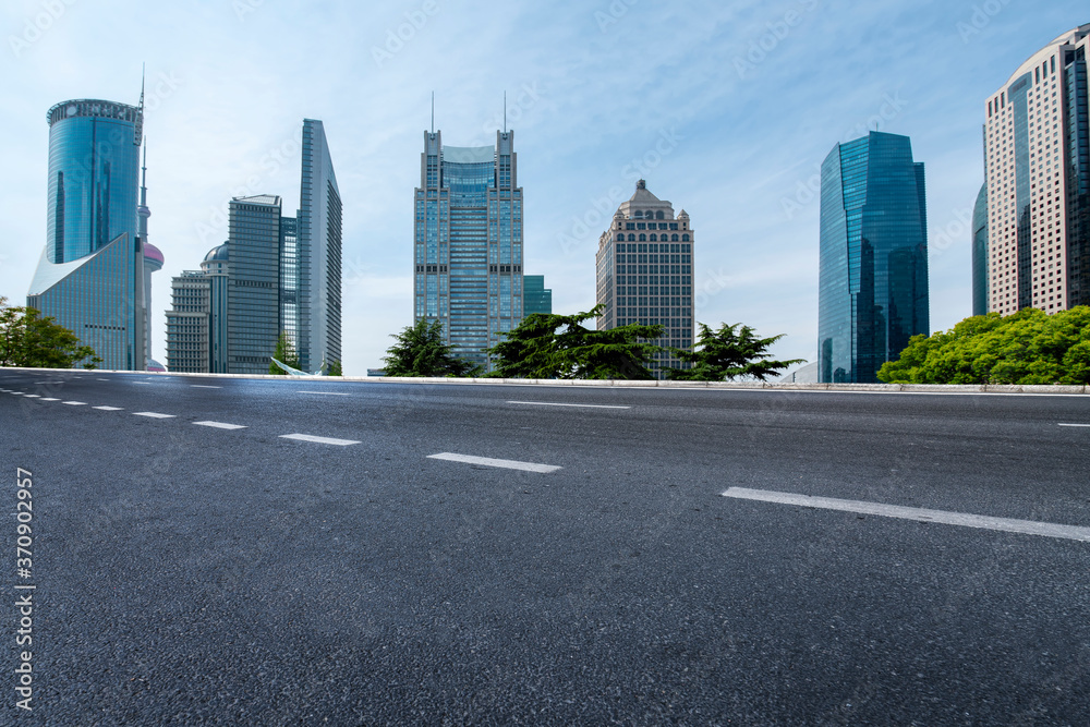 city road through modern buildings in China