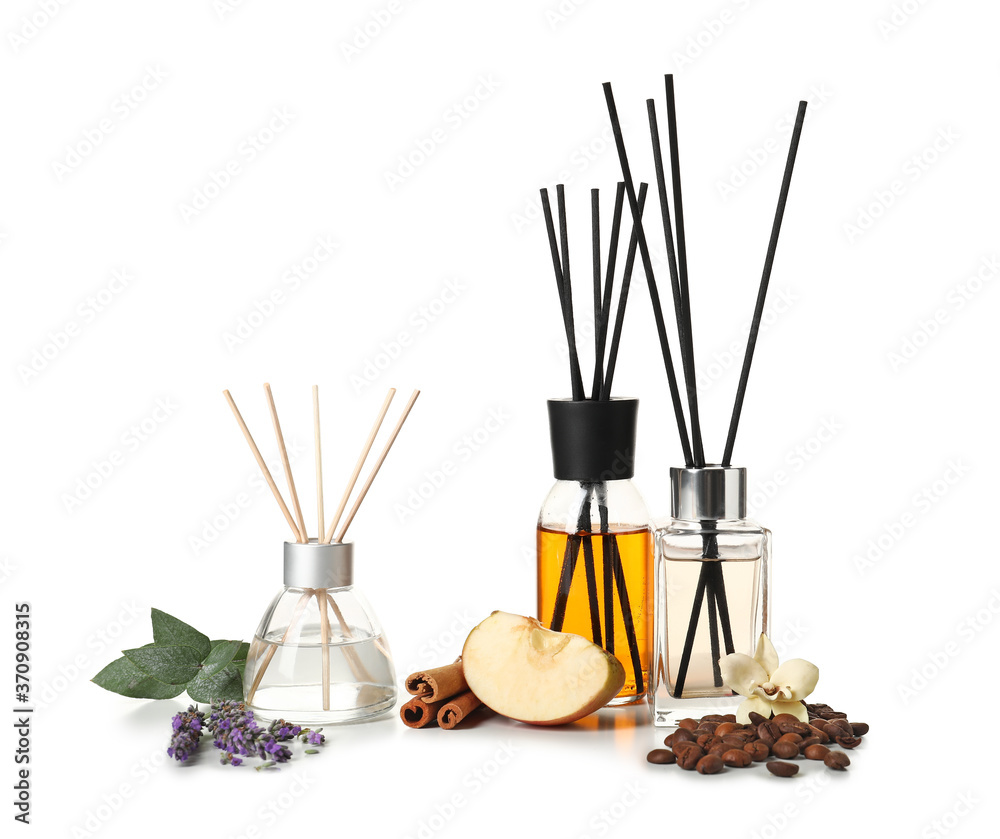 Different reed diffusers on white background