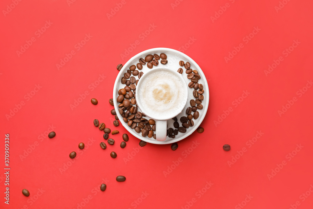 Cup of hot coffee on color background