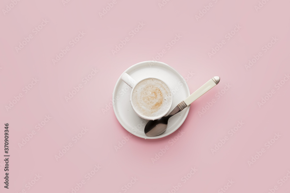 Cup of hot coffee on color background