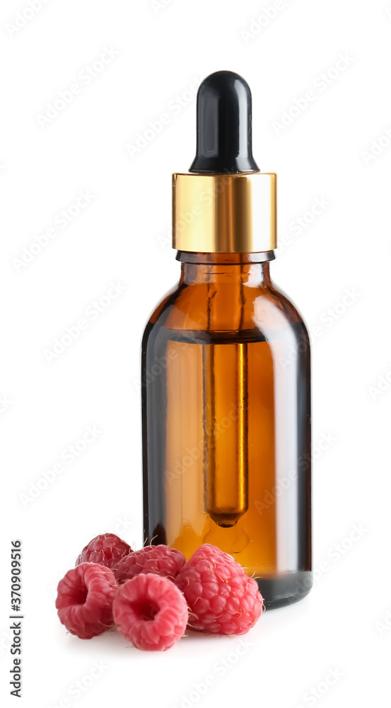 Bottle of raspberry essential oil on white background