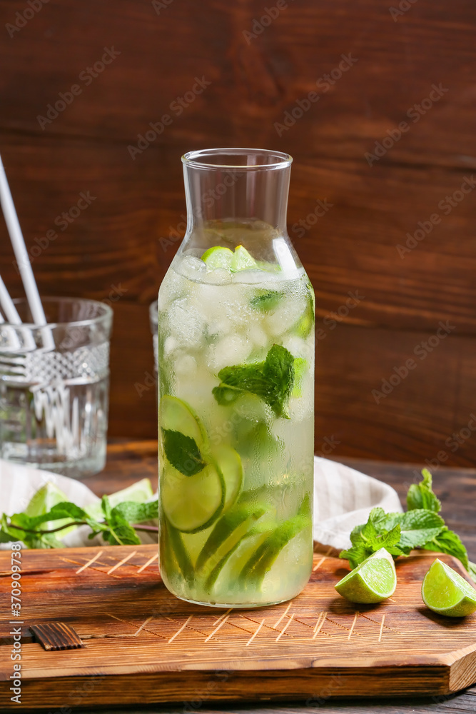 Bottle of fresh mojito on table