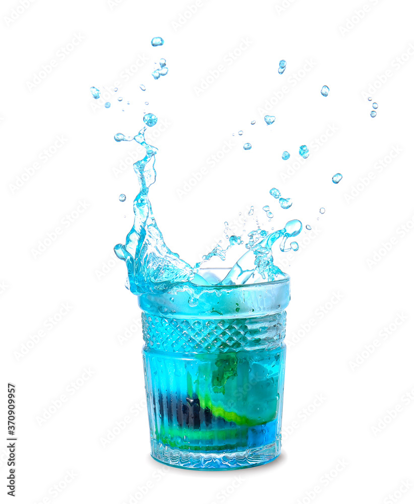 Glass of tasty blue mojito cocktail with splashes on white background