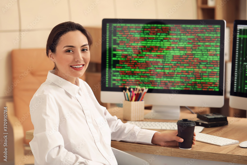 Portrait of female programmer in office