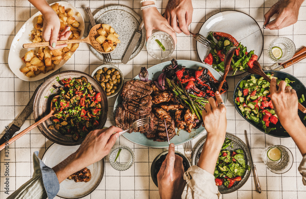 Summer barbeque party. Flat-lay of table with grilled meat, vegetables, salad, roasted potato and pe