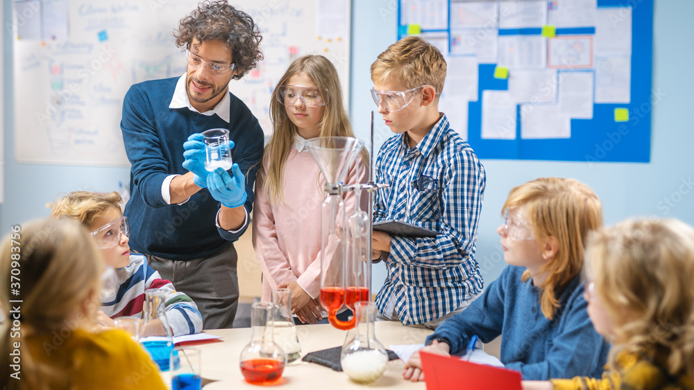 Elementary School Science Classroom: Enthusiastic Teacher Explains Chemistry to Diverse Group of Chi