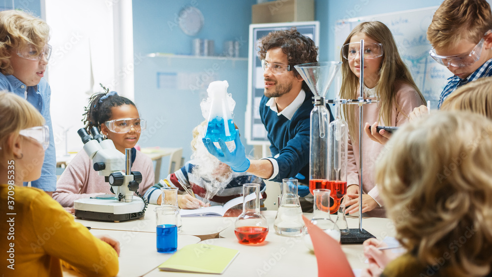 Elementary School Science Classroom: Enthusiastic Teacher Explains Chemistry to Diverse Group of Chi