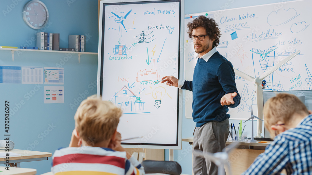 Elementary School Physics Teacher Uses Interactive Digital Whiteboard to Show to a Classroom full of