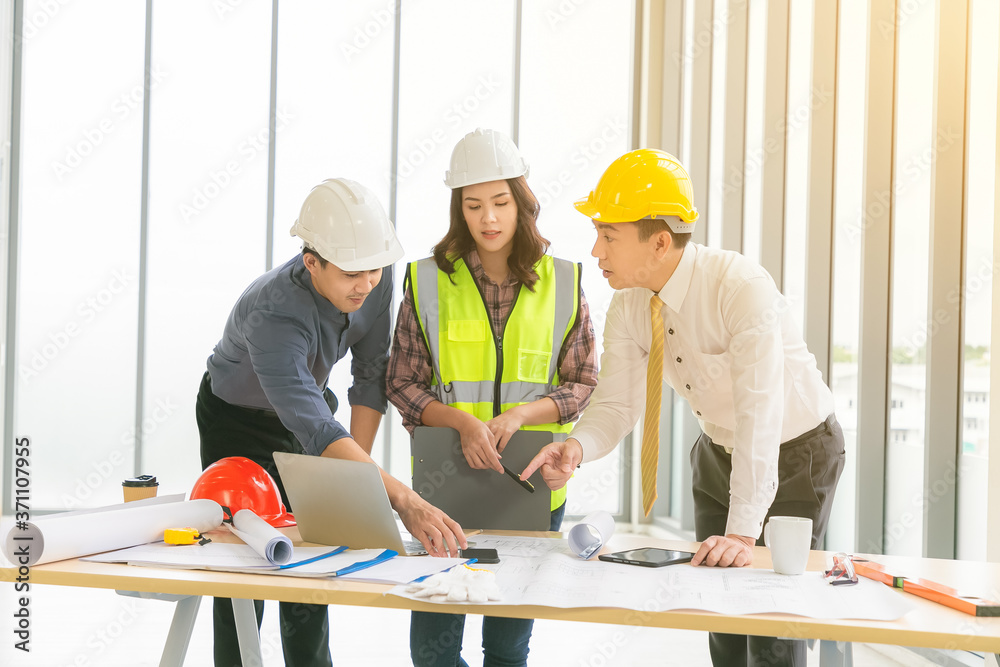 Team of Engineer and businessman meeting, team discussion with construction on site work.