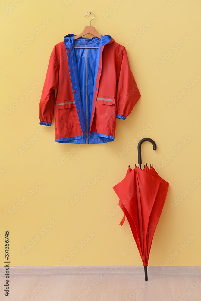 Raincoat and umbrella in hallway