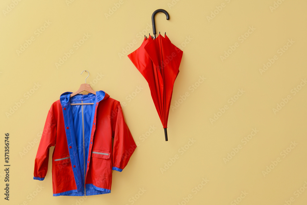 Raincoat and umbrella in hallway