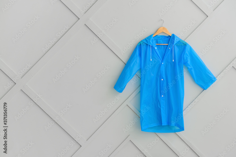 Raincoat hanging on wall in hallway