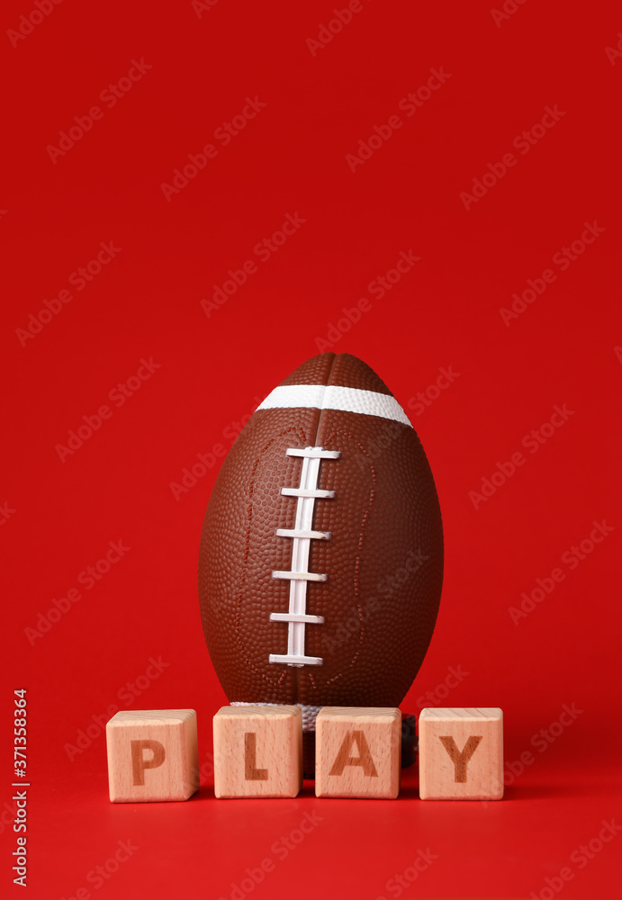 Rugby ball and cubes with text PLAY on color background