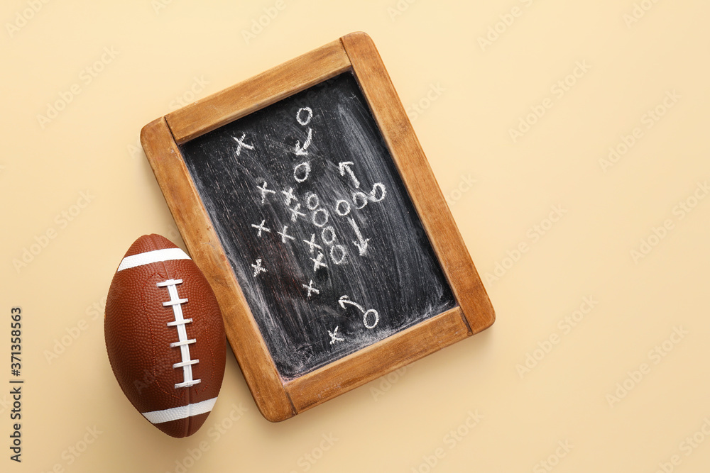 Rugby ball with scheme of football game drawn on color background