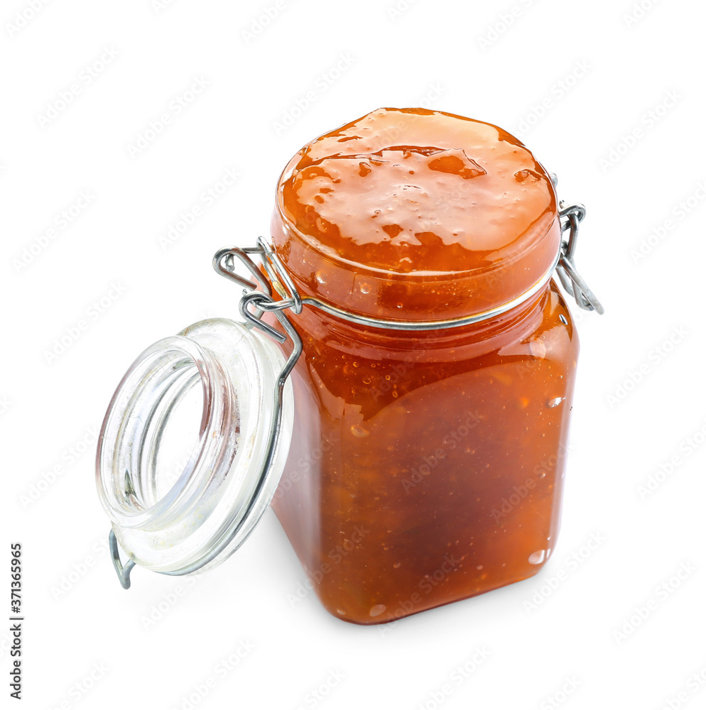 Jar of tasty peach jam on white background