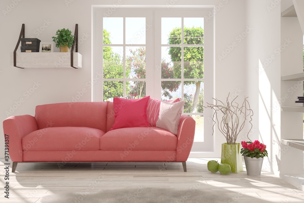 White stylish minimalist room with coral sofa and summer landscape in window. Scandinavian interior 