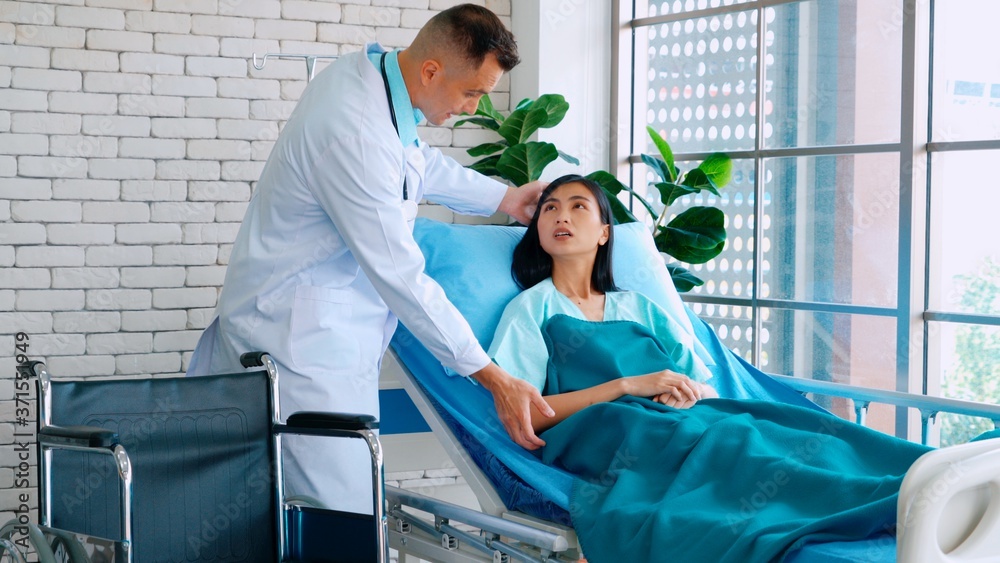 Doctor in professional uniform examining patient at hospital or medical clinic. Health care , medica