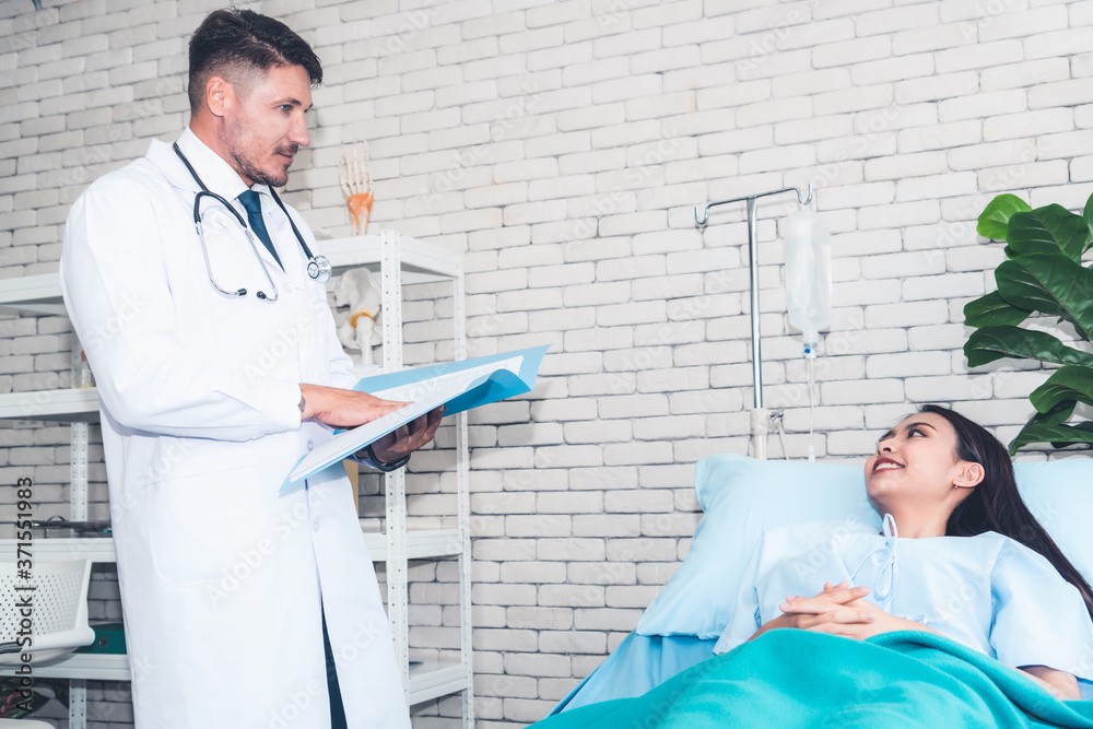 Doctor in professional uniform examining patient at hospital or medical clinic. Health care , medica