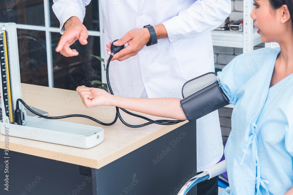 Doctor in professional uniform examining patient at hospital or medical clinic. Health care , medica