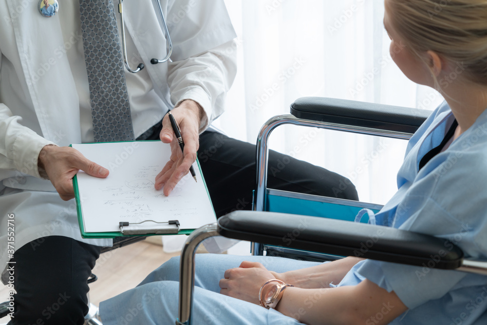 Doctor in professional uniform examining patient at hospital or medical clinic. Health care , medica