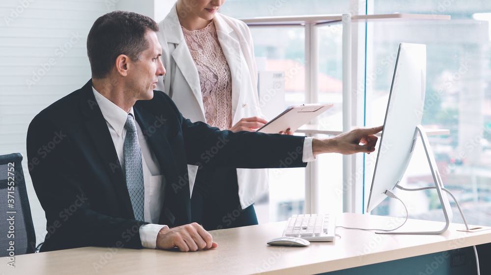 Two business people talk project strategy at office meeting room. Businessman discuss project planni