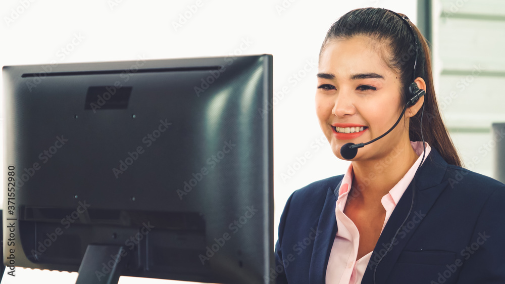 Business people wearing headset working in office to support remote customer or colleague. Call cent