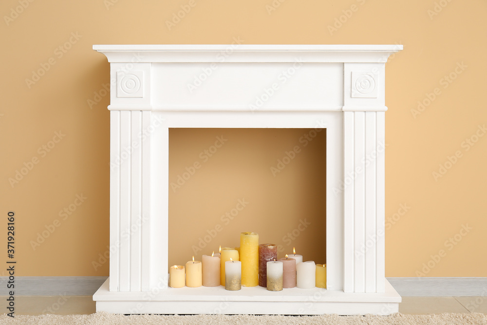 Modern fireplace near wall in room