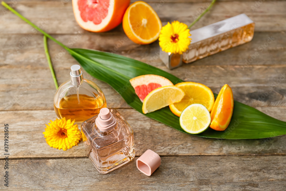 Composition with floral and citrus perfumes on table