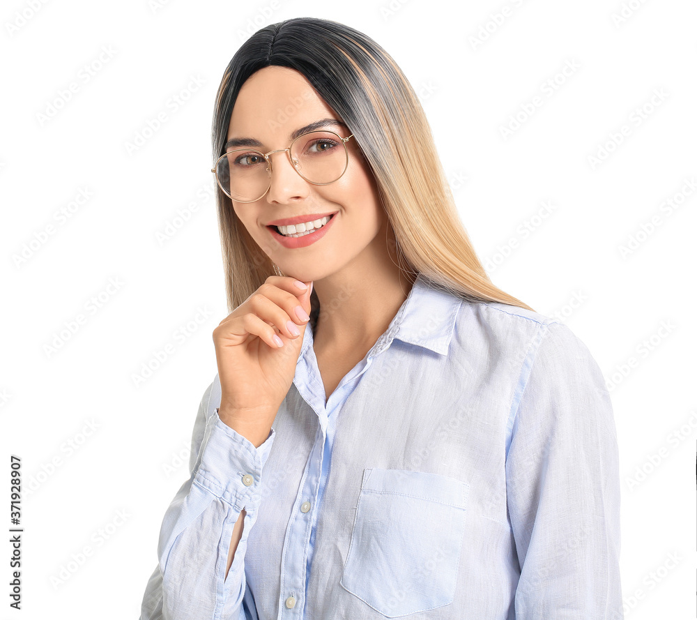 Beautiful young woman in wig on white background