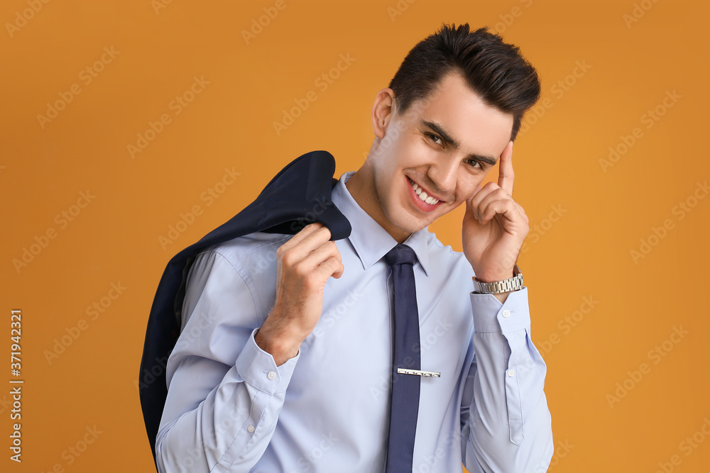 Handsome businessman with stylish hairdo on color background