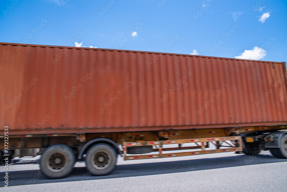 A container transport trailer speeding on the highway in Guangzhou Port Area, China