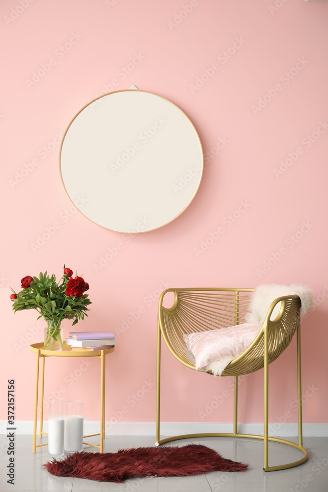 Interior of modern room with mirror, armchair and table