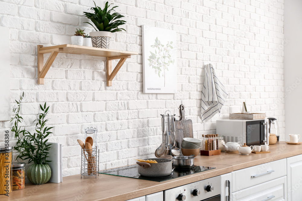 Set of utensils and products on kitchen counter