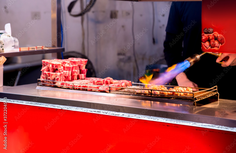 regional food in China: flame pork on cooking
