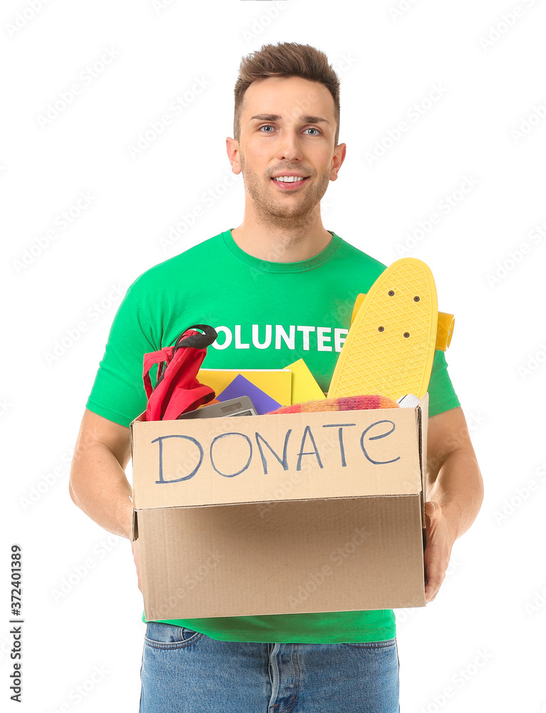 Male volunteer with donations for orphans on white background