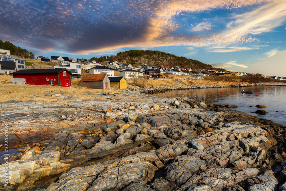 Beautiful landscape of rocky coastline in Norway at sunset