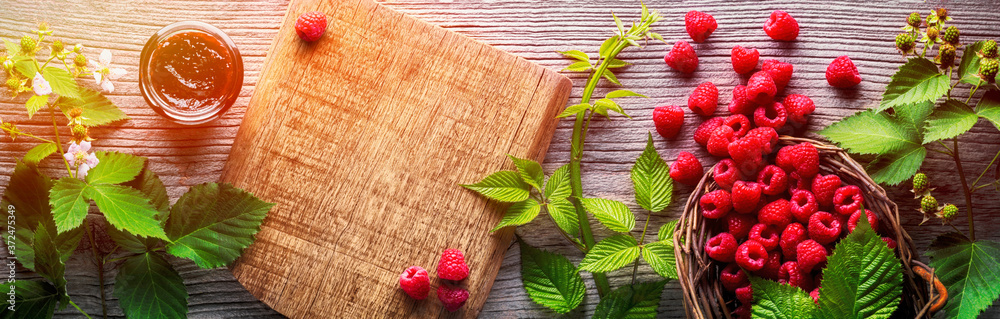 Raspberry on wooden board