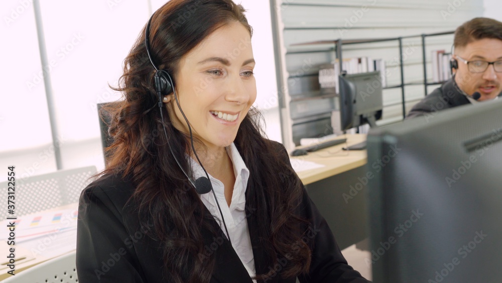 Business people wearing headset working in office to support remote customer or colleague. Call cent