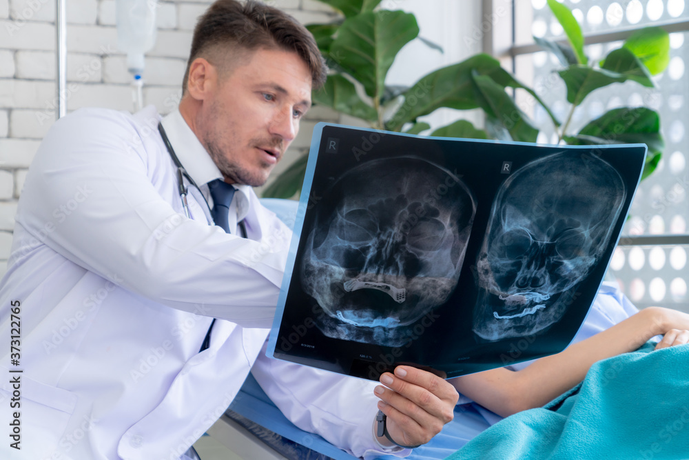 Doctor in professional uniform examining patient at hospital or medical clinic. Health care , medica