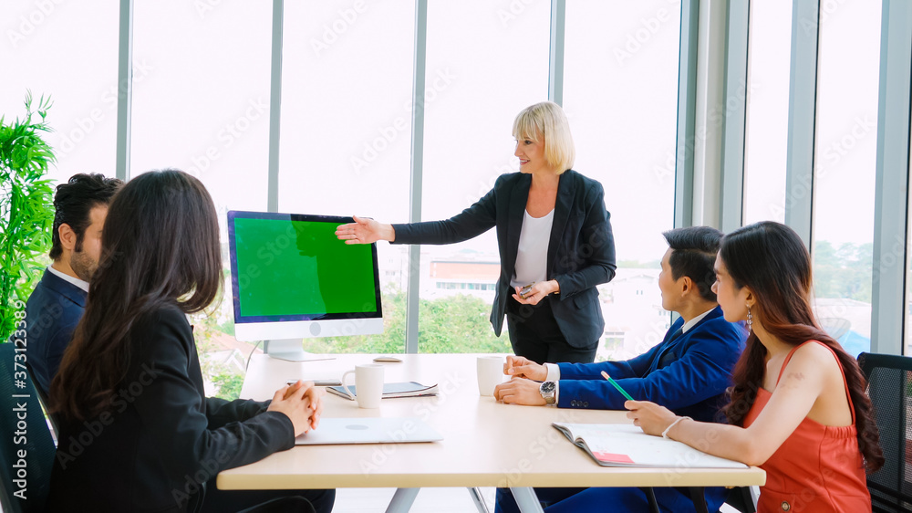 Business people in the conference room with green screen chroma key TV or computer on the office tab