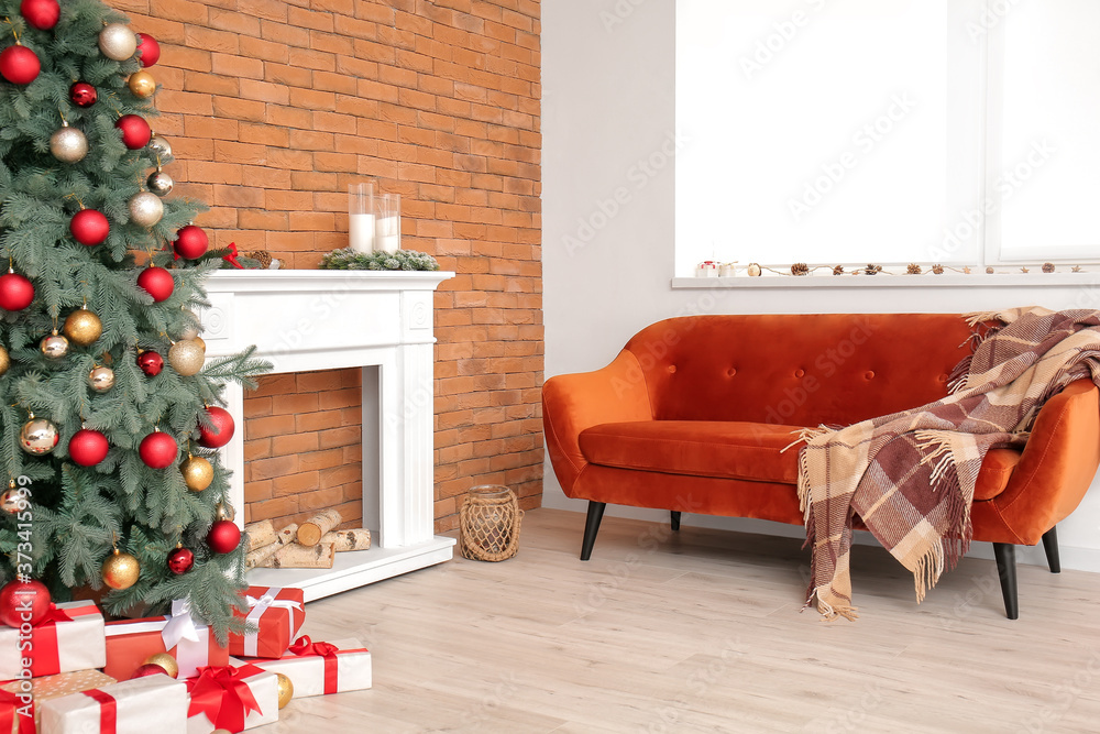 Interior of modern room with fireplace on Christmas eve