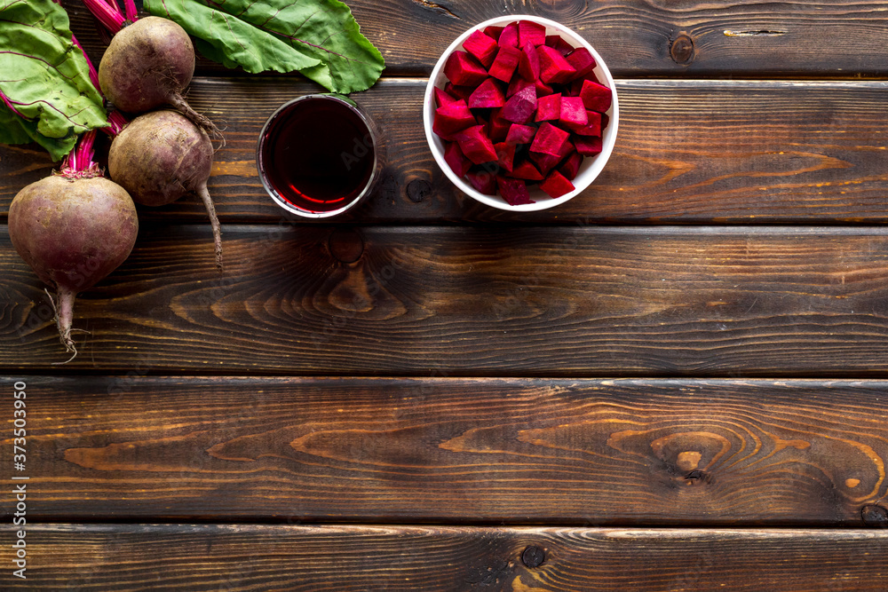 Top view of beet harvest. Green tops, slices, juice top-down space for text