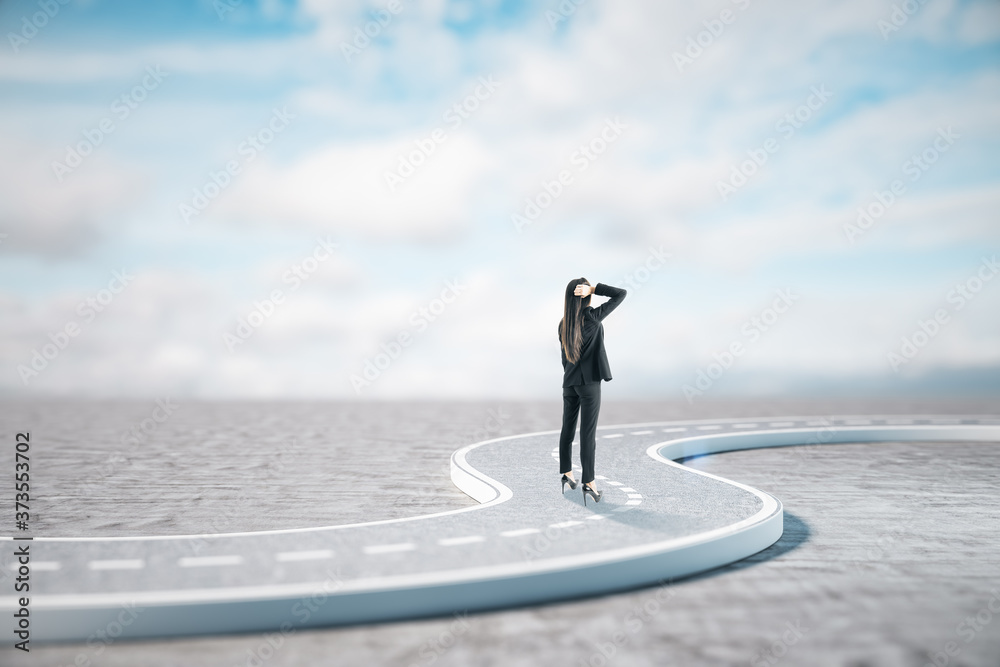 Businesswoman standing on road