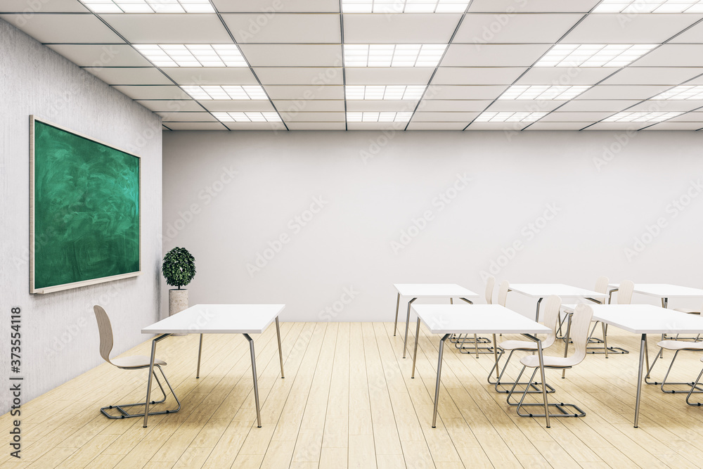 Stylish classroom interior with empty green chalkboard