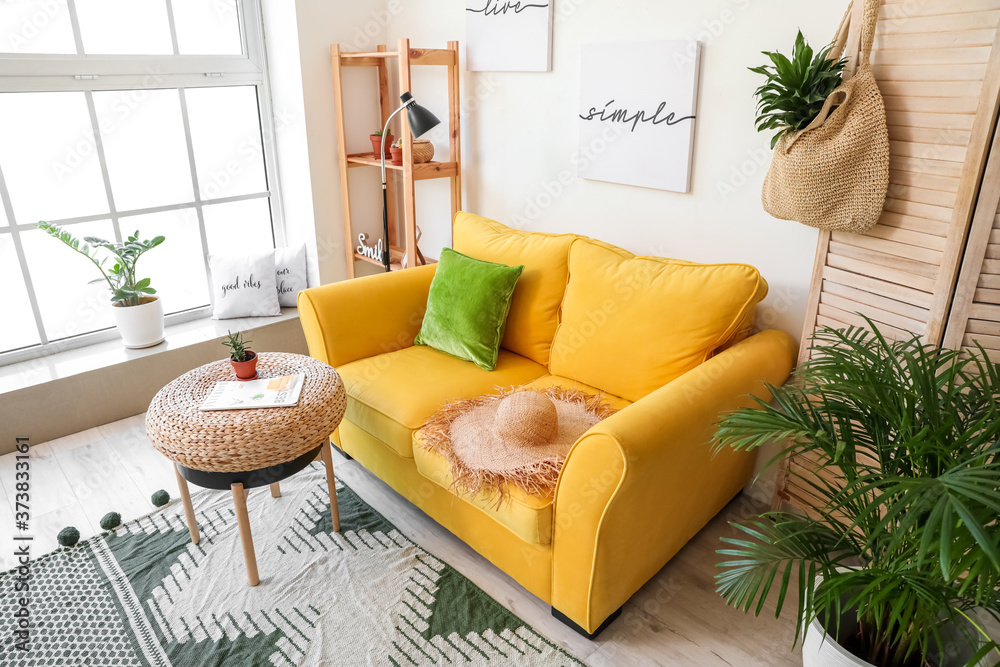 Interior of modern room with cozy sofa