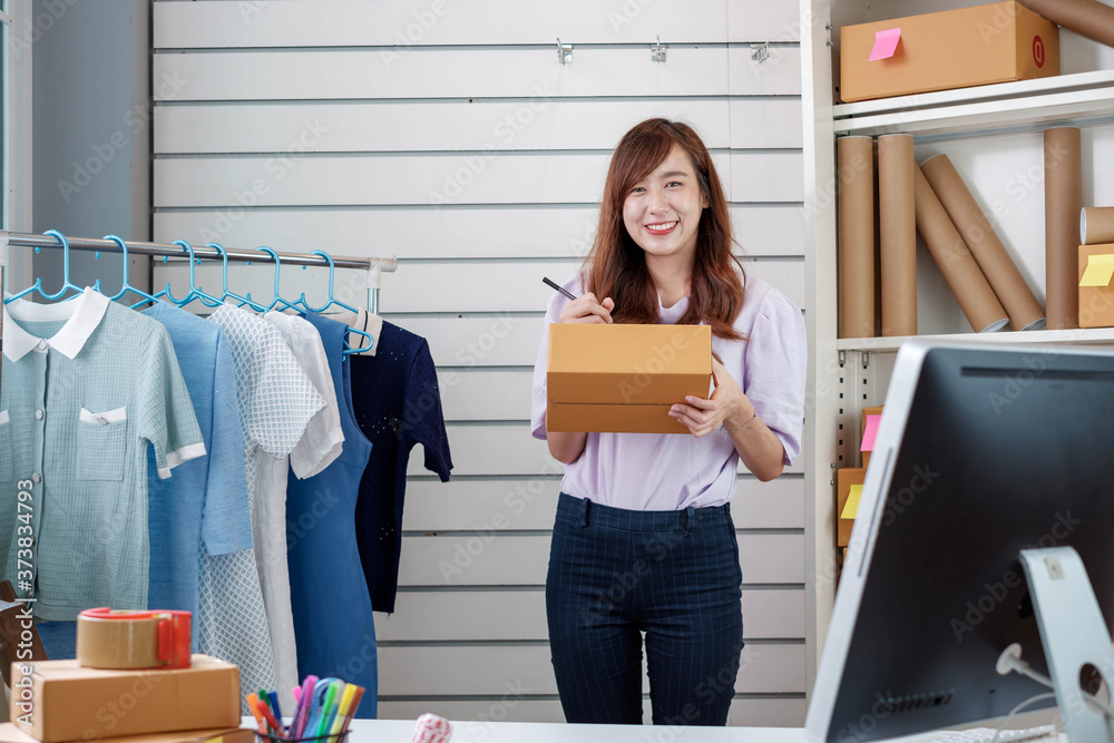 Asian small business owners working at home offices inspect products before delivering to their cust