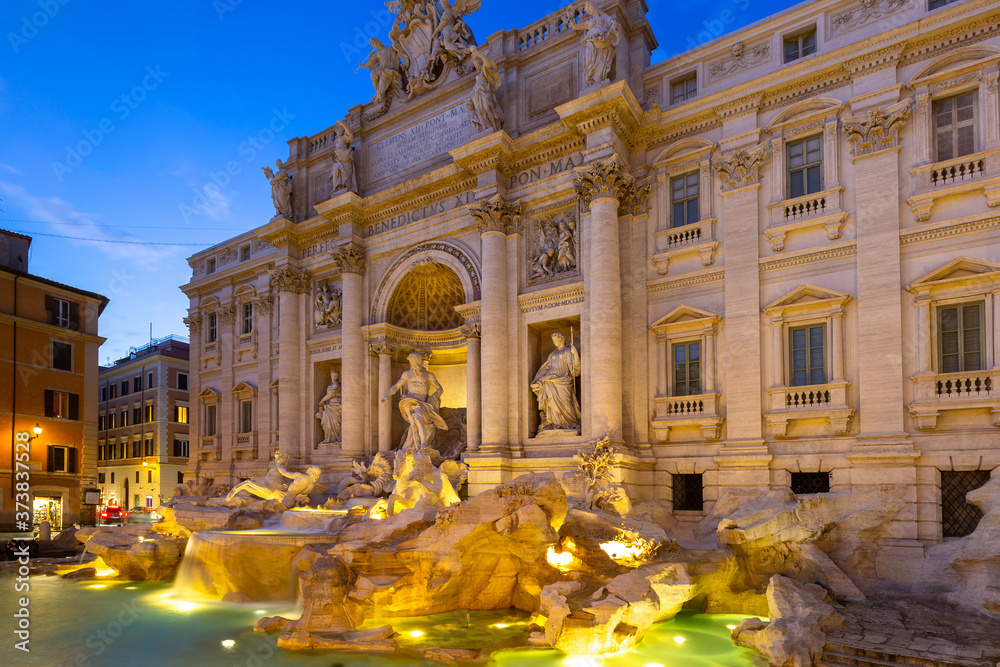 Beautiful architecture of the Trevi Fountain in Rome at dusk, Italy