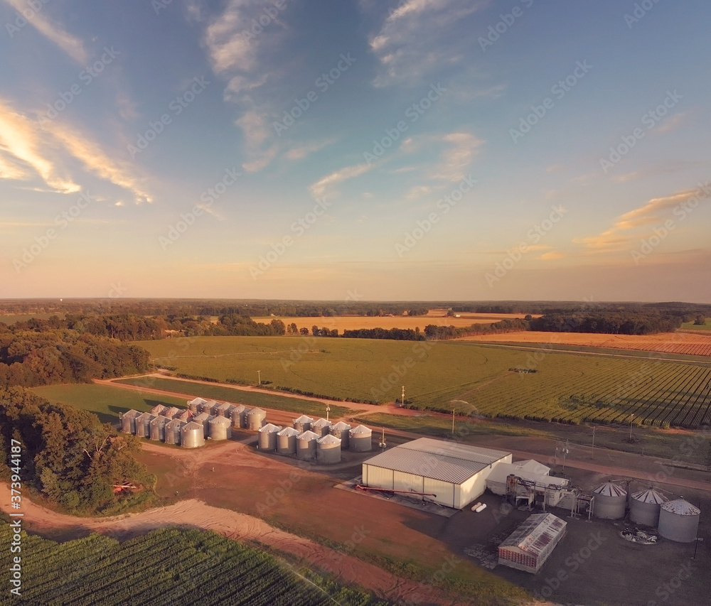  Aerial landscape of farm with a large modern plant for the storage and processing of grain crops.