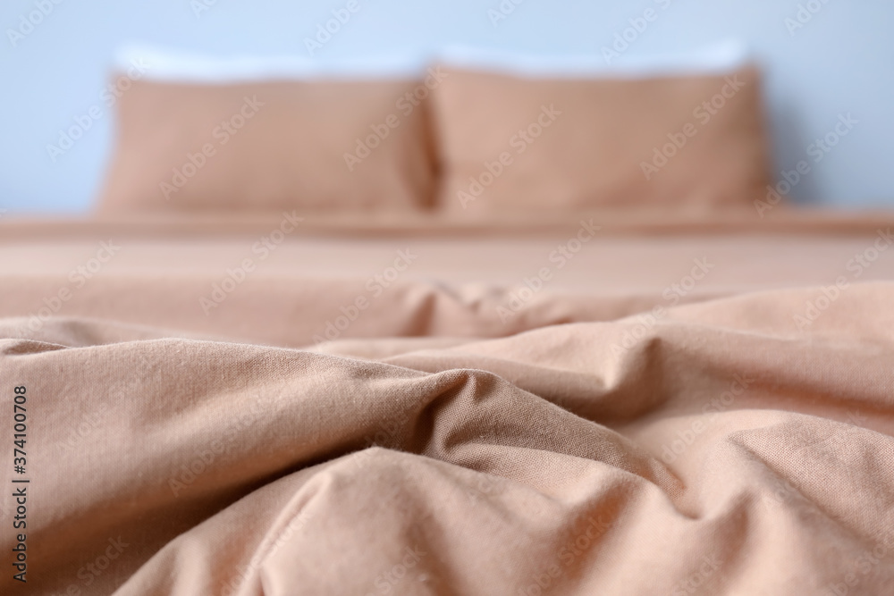 Clean sheet on bed, closeup