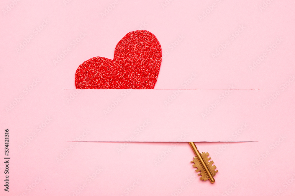 Paper heart with key on color background